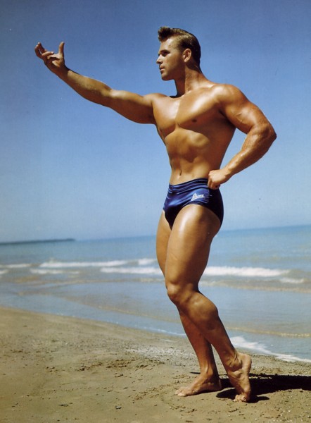50s model stud DouglaS posing on beach (color)